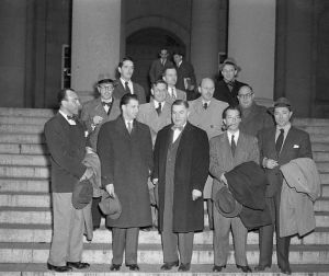 12 Dec 1947, Los Angeles, California, USA --- Cited for Contempt.  Los Angeles:  Nine of Ten Hollywood writers, directors, and producers cited for contempt of Congress, await fingerprinting in the U.S. Marshall's Office after they surrendered.  They are (left to right), Robert Scott, Edward Dmytryk, Samuel Ornitz, Lester Cole, Herbert Biberman, Albert Maltz, Alvah Bessie, John Lawson, and Ring Lardner, Jr.  Dalton Trumbo is scheduled to appear shortly.  These are the men who refused to state whether or not they are Communists when questioned by the House Un-American Activities Committee in Washington recently. --- Image by © Bettmann/CORBIS